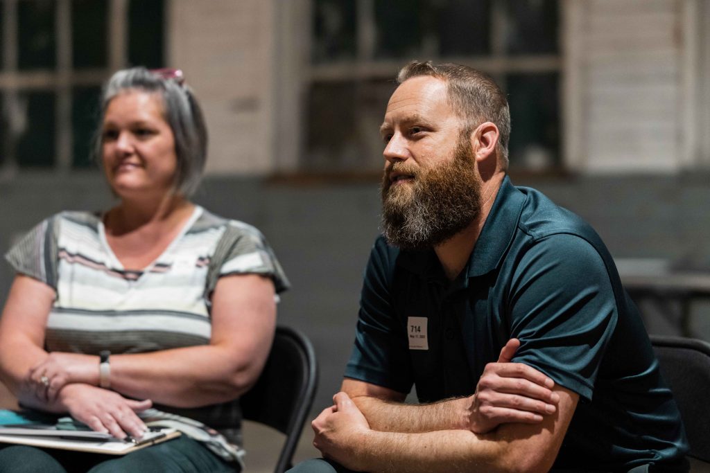 man-and-woman-listening-sitting-down-experience-community-church